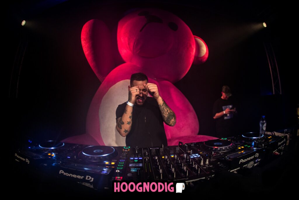 Large 4.75 meter pink inflatable teddy bear as eye-catching decoration at festival.