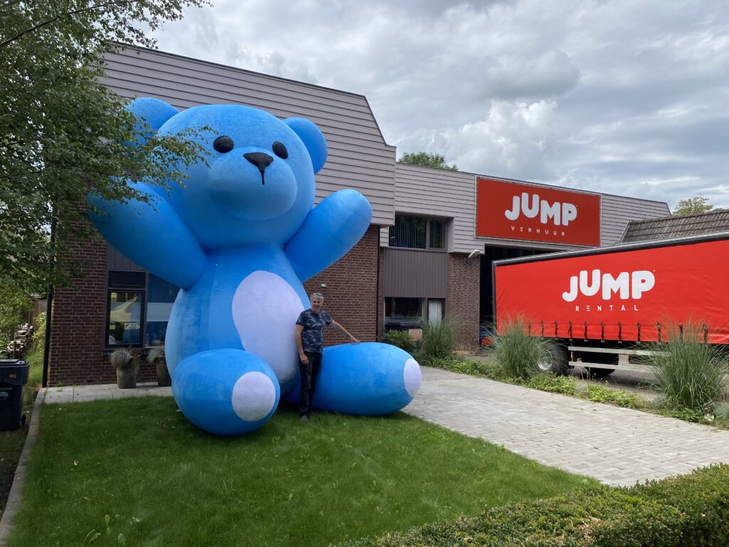 Soft plush-looking 5-foot teddy bear as an eye-catching festival decoration - ideal for photo spots and family areas.